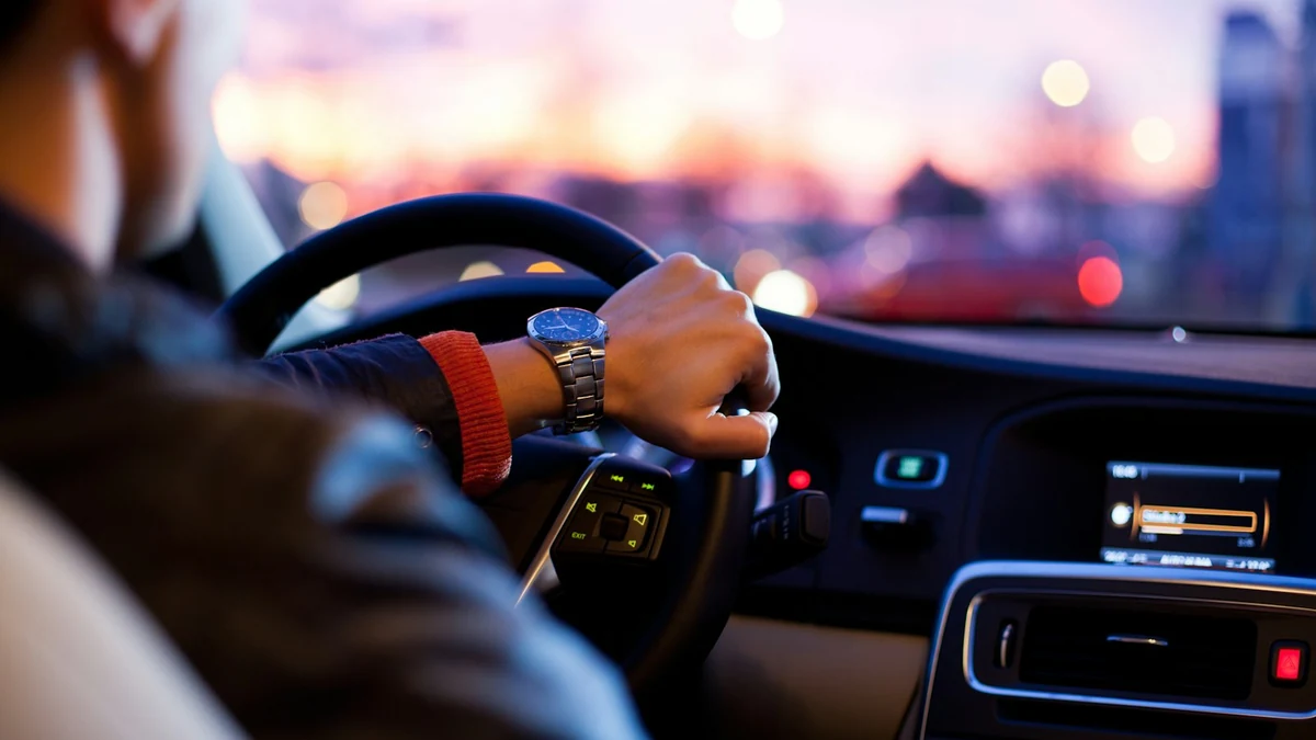Student driver practicing a clean 3-point turnabout maneuver on a quiet suburban residential street